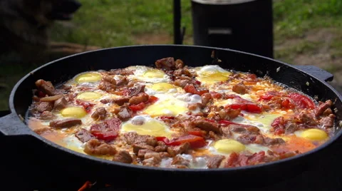 The fried eggs with ham and tomatoes. Zoom in. Stock Footage 54911265