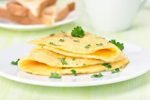 Fried eggs with herbs Stock Photos