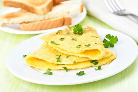 Fried eggs with herbs Stock Photos