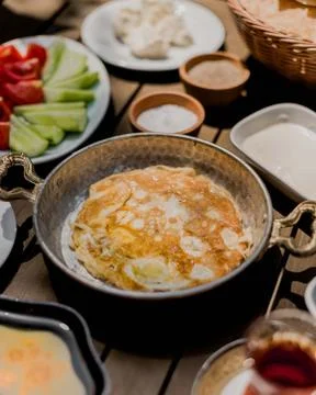 Fried eggs omlet on the table Stock Photos