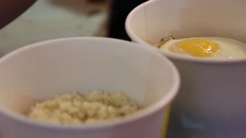 Fried eggs or sunny side up eggs are in focus Stock Footage 268515748