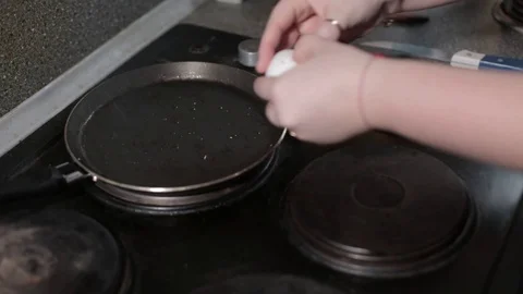 Fried eggs in a pan. Broken egg falls into the frying pan Stock Footage 88398321