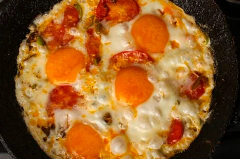Fried eggs in a pan Stock Photos