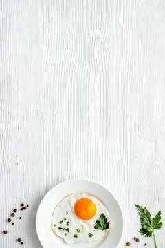 Fried eggs on plate - white background top-down copy space Stock Photos