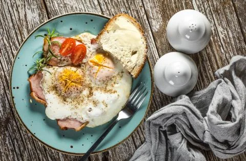 Fried eggs with pork ham. Stock Photos