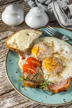 Fried eggs with pork ham. Stock Photos