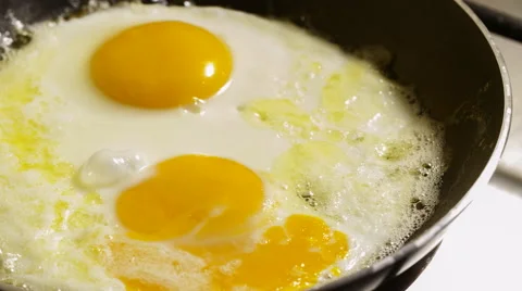 Fried eggs preparation on a pan, time lapse Stock Footage 47690409