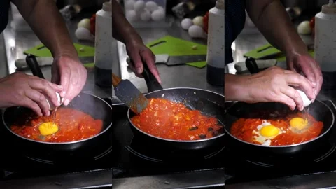Fried eggs in a sauce of fresh tomatoes, peppers, onions and spices in a frying Stock Footage 314059711