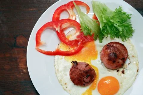 Fried Eggs With Sausage Stock Photos
