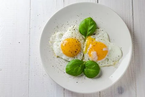 Fried eggs shape hearts Valentines dish Stock Photos