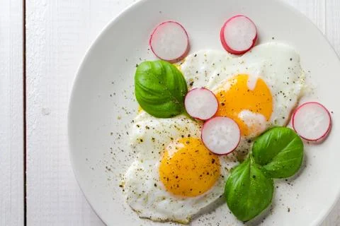Fried eggs shape hearts Valentines dish Stock Photos