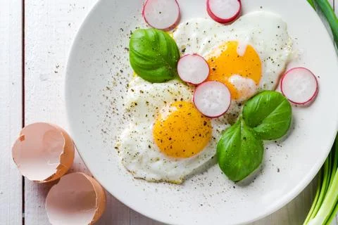 Fried eggs shape hearts Valentines dish Stock Photos