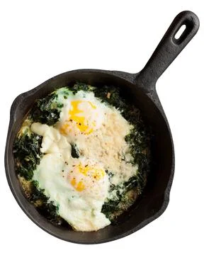 Fried eggs with spinach Stock Photos