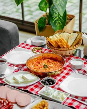 Fried eggs with tomatoes and greenery Stock Photos