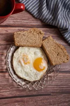 Fried eggs with two slices of bread Stock Photos