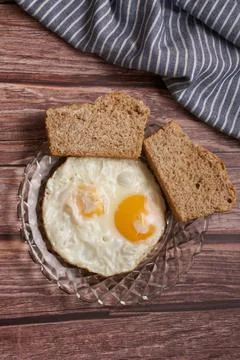 Fried eggs with two slices of bread Stock Photos