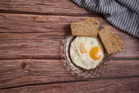Fried eggs with two slices of bread Stock Photos