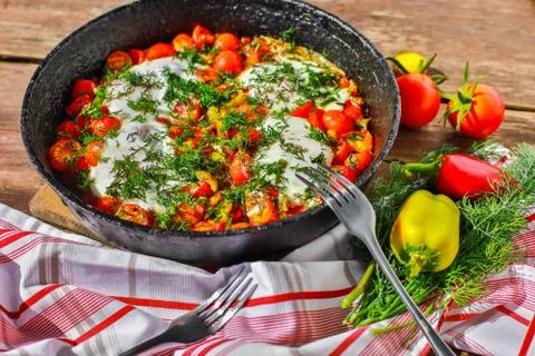 Fried eggs with vegetables in a pan Stock-Fotos