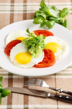 Fried eggs with vegetables Stock-Fotos