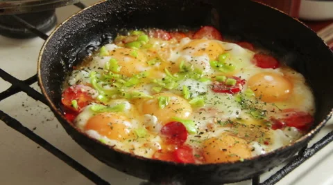 Fried Eggs with Vegetables Prepared on a Frying Pan Stock Footage