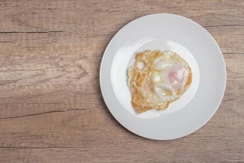 Fried eggs on a white background Foto stock