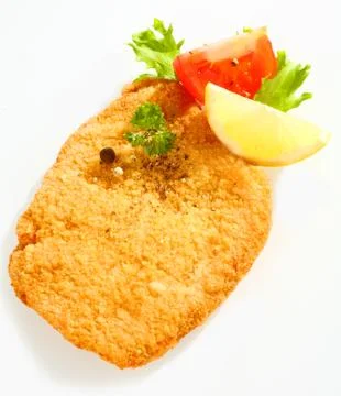 Fried escalope of veal with lemon Stock Photos