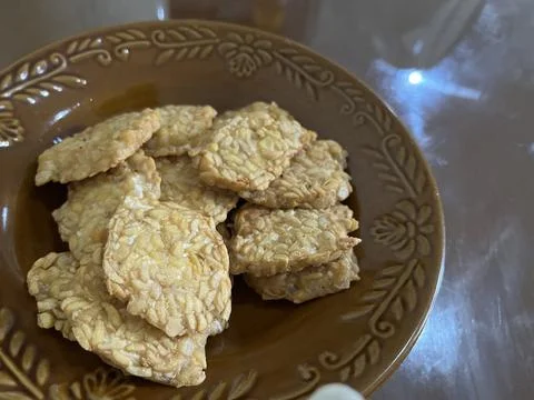Fried fermented soybean cake served in a brown plate, Stock Photos