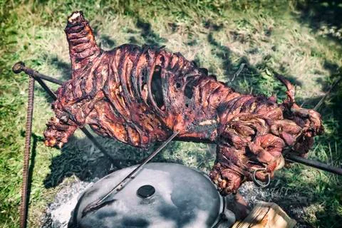 Fried on a fire carcass of a RAM. Stock Photos
