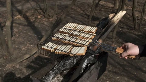 Fried on fire white bread-toast. A delicious and exquisite way of making brea Video stock 105313197
