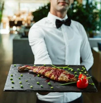 Fried fish on the board Stock Photos