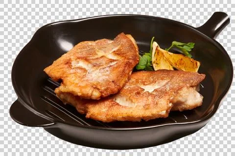 Fried fish on a ceramic plate. Serving a fish dish of fried fish fillet Stock Photos