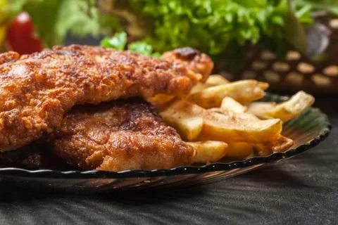 Fried fish in crispy batter with chips Stock Photos
