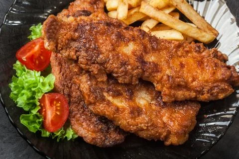 Fried fish in crispy batter with chips Stock Photos