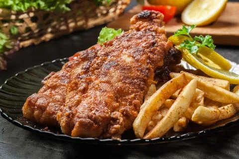 Fried fish in crispy batter with chips Stock Photos