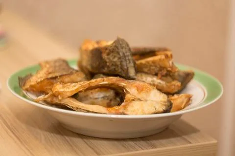 Fried fish is a dish, close-up Stock Photos