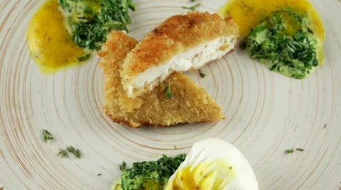 Fried fish fillet with soft poached egg and spinach, loop Stock Footage 66482292