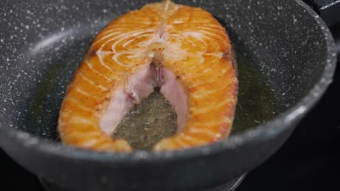 Fried fish in a frying pan 1 Stock Footage 268576531