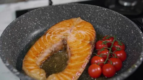 Fried fish in a frying pan 2 Stock Footage 268576588