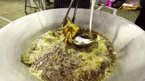 Fried fish in a frying pan Stock Footage 107271857
