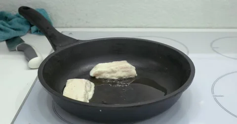 Fried fish in a frying pan Stock Footage 145391184