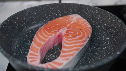 Fried fish in a frying pan Stock Footage 268576567