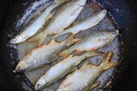 Fried fish in a frying pan Stock-Fotos
