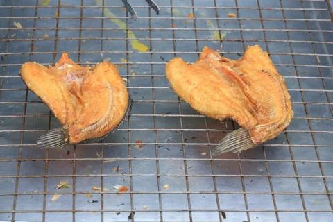 Fried fish on the grill. Stock Photos
