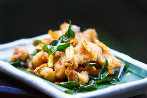 Fried fish with herbs Stock Photos