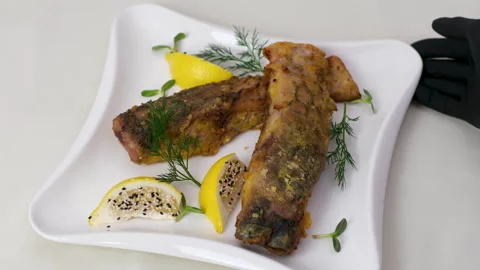 Fried fish lemons breaded fish with dipping sauce and lemon Stock Footage 319786185
