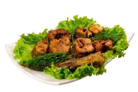 Fried fish on lettuce Stock Photos