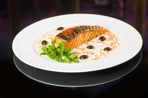 Fried fish with olives Stock Photos