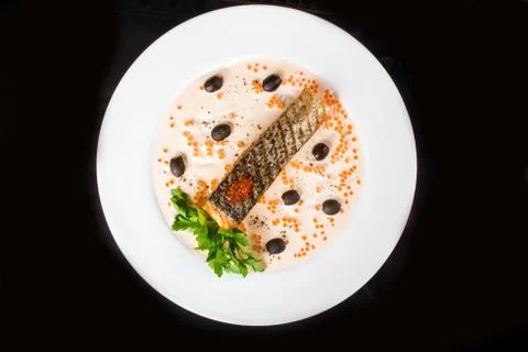 Fried fish with olives Stock Photos