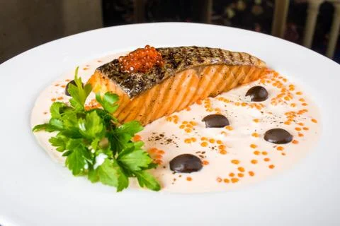 Fried fish with olives Stock Photos
