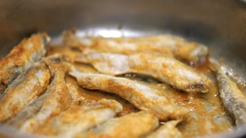 Fried Fish In Pan. Fish Frying In Oil. Roasted Seafood Cuisine 4K Stock Footage 267790514